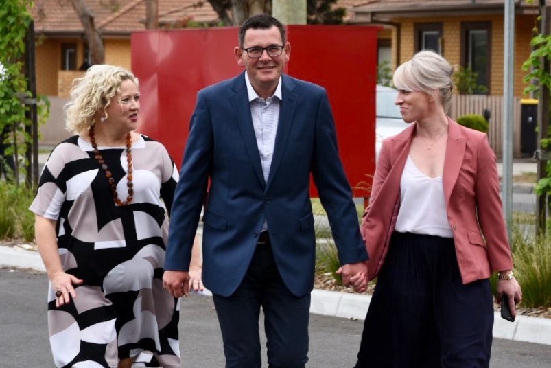 Daniel Andrews arrives at Monash Children's Hospital flanked by Jill Hennessy and his wife Catherine.