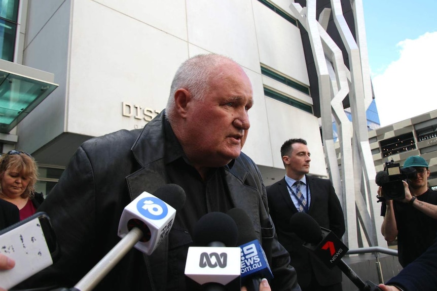 Murray Heyward talking to the media outside a court building in Perth.