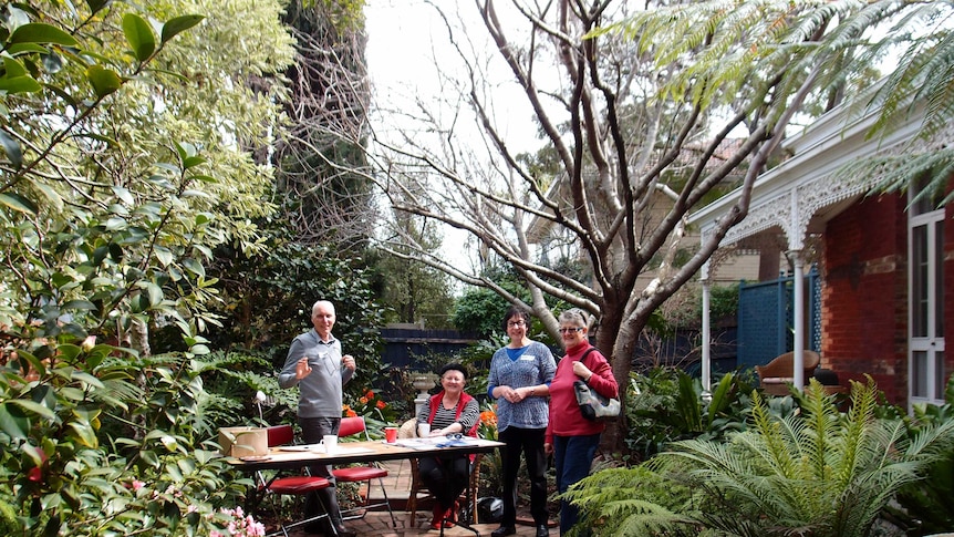 People around a table in a garden