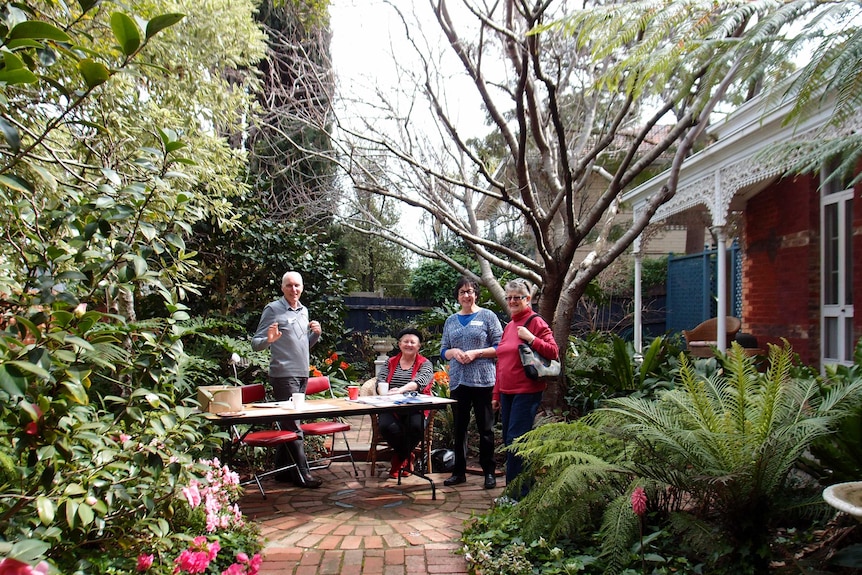 People around a table in a garden