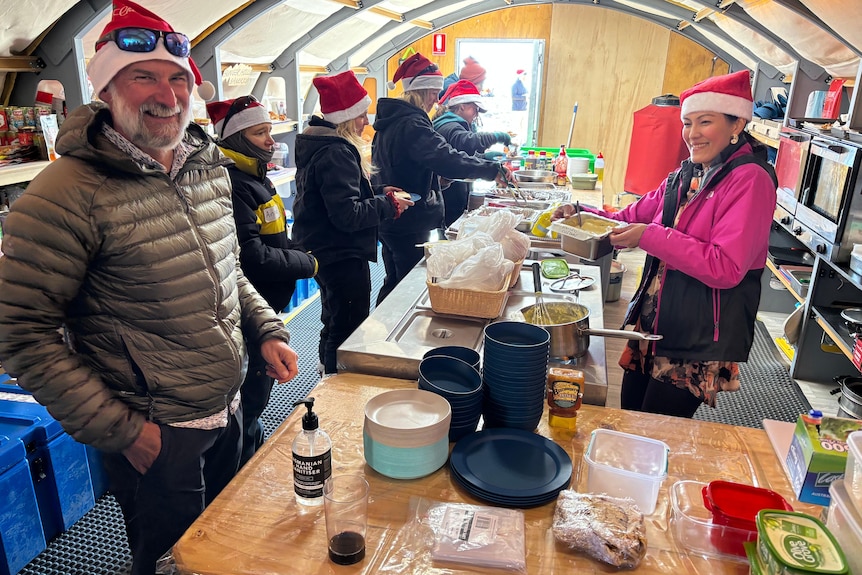 Chief Scientist David Souter and camp chef Jacqui Hsieh in the kitchen tent on Christmas day