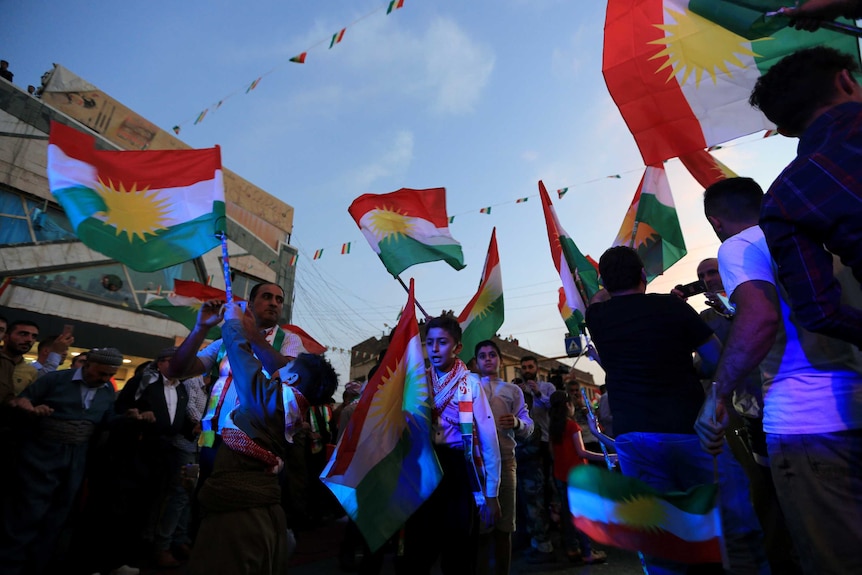 Kurds celebrate to show their support for the independence referendum.