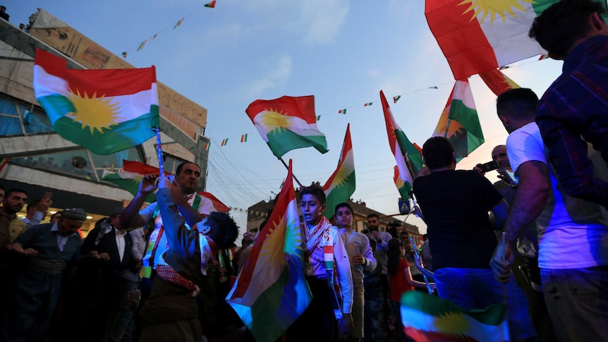 Kurds celebrate to show their support for the independence referendum.