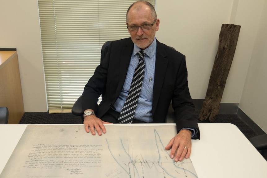 Surveyor-General Michael Burdett with Poeppel's map