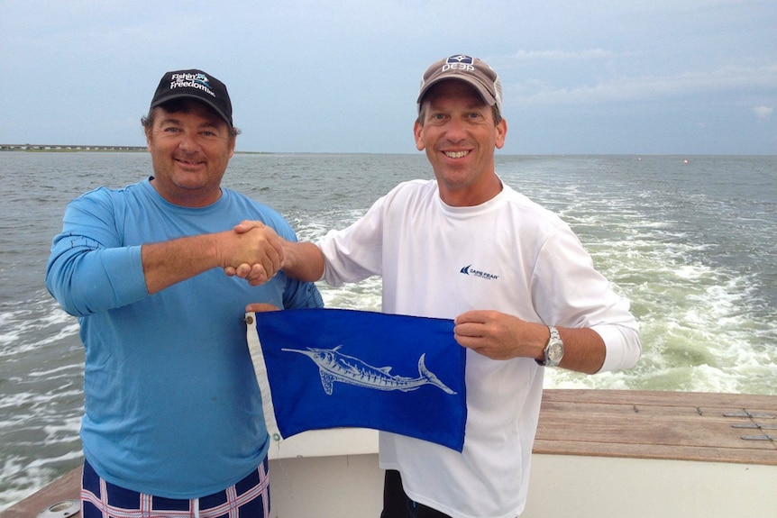Matt Price receives his blue marlin flag while chasing the grand slam overseas.
