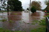 Water floods the streets of Tinamba, Victoria