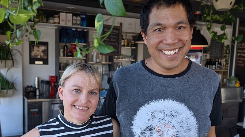 Chef Kym Machin smiles with wife Jade in their cafe in Jindalee.