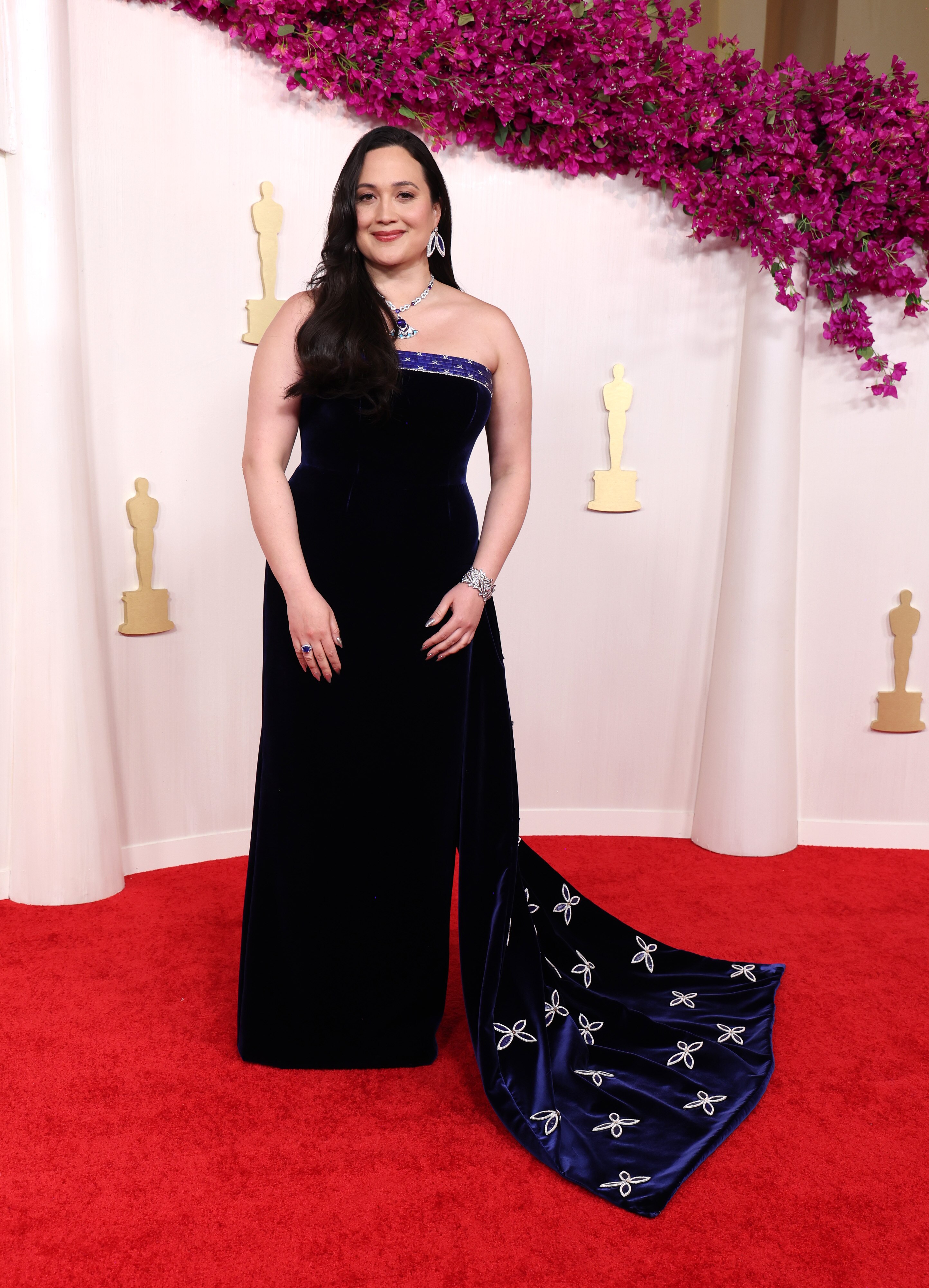Lily Gladstone poses on the red carpet at the 2024 Oscars.