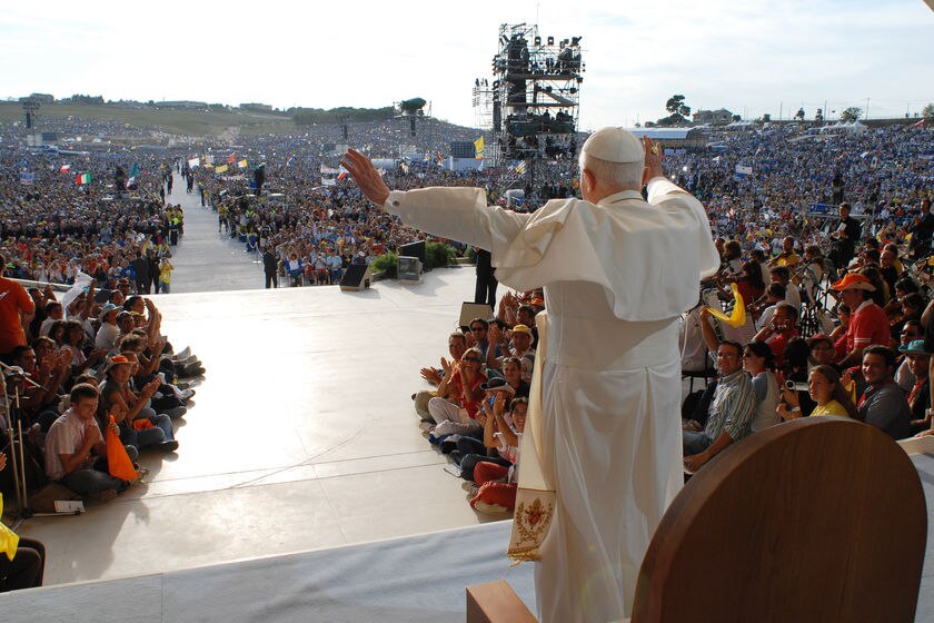 The Pope waves to pilgrims gathered in Loreto, Italy.