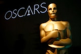 A gold statue appears in front of the word Oscars