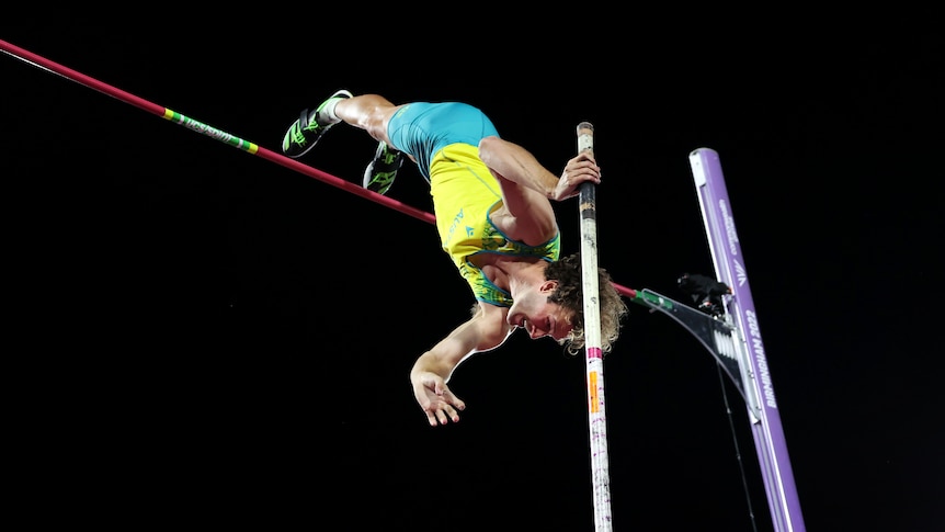 Kurtis Marschall leaps over the bar as shown from below