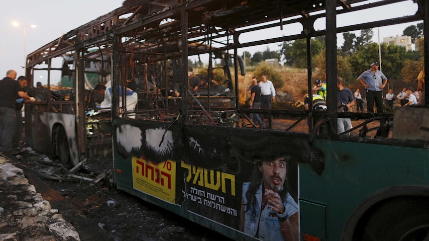 Israeli police forensic experts work at the explosion scene