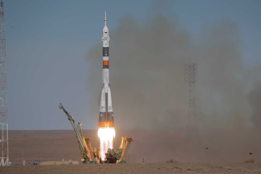 The Soyuz-FG rocket booster carrying the Soyuz MS-10 blasts off for the International Space Station.