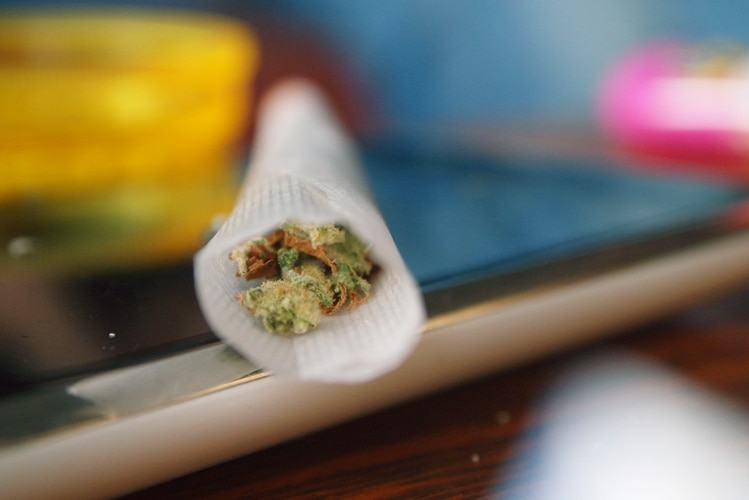 Close up of a marijuana smoke on a table.