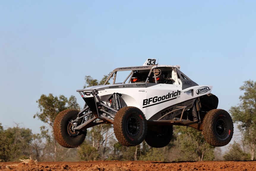 Modified four wheel drive becoming air borne during a race