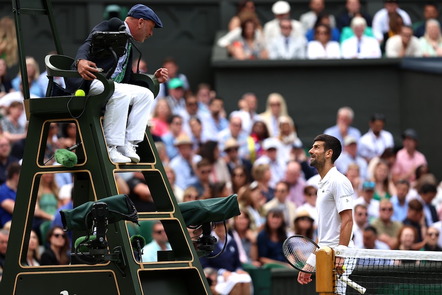 Novak Djokovic of Serbia speaks to Umpire during Wimbledon tennis match. 