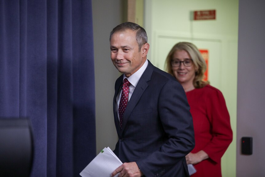 Roger Cook leads Rita Saffioti in to the room before the deliver a press conference