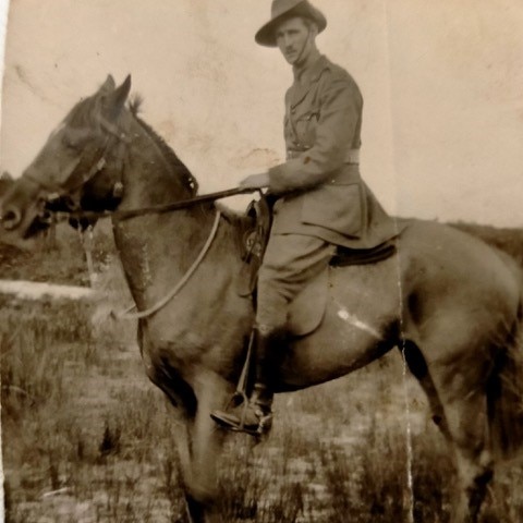 man on horse in military outfit