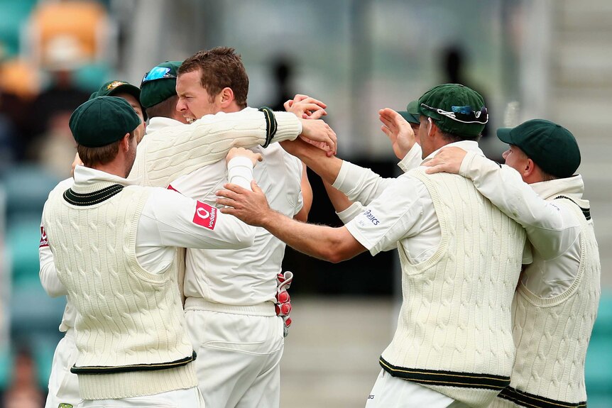 First scalp ... Peter Siddle celebrates after claiming Mahela Jayawardene's wicket.