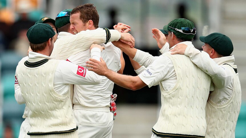 First scalp ... Peter Siddle celebrates after claiming Mahela Jayawardene's wicket.