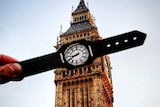 A photo of the Big Ben with a wristwatch cut out.