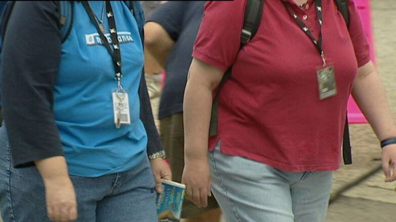 Anonymous overweight women walking (ABC TV-file image)