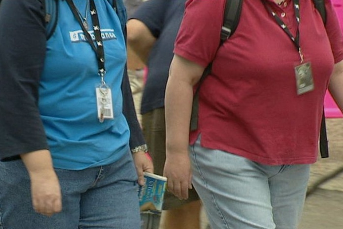 Anonymous overweight women walking (ABC TV-file image)