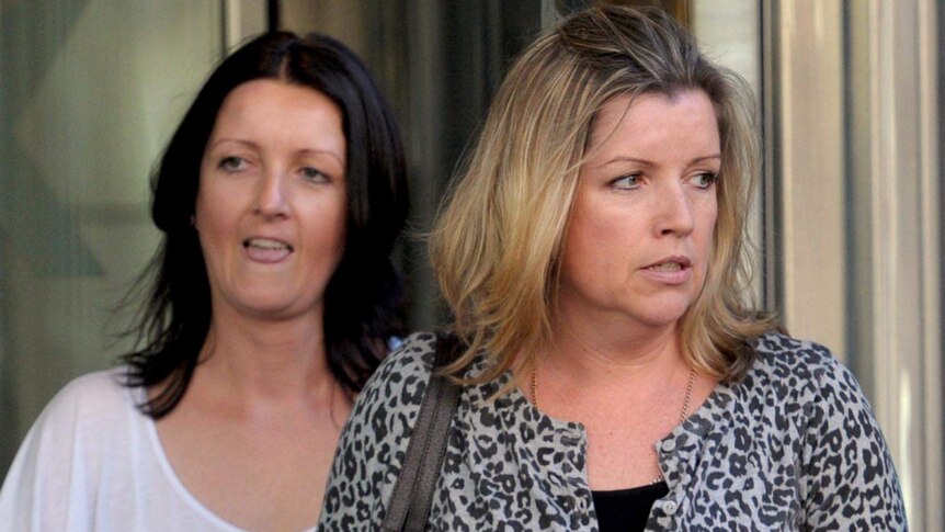 Sisters Mandy Hodson and Nicola Komiazyk leave the County Court in Melbourne.