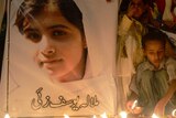 Children pray for shot Pakistani girl