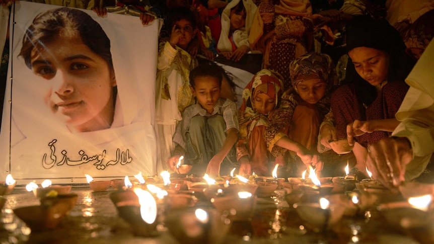 Children pray for shot Pakistani girl