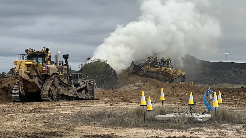 Remote control dozers are helping seal the burning Grosvenor Coal Mine.