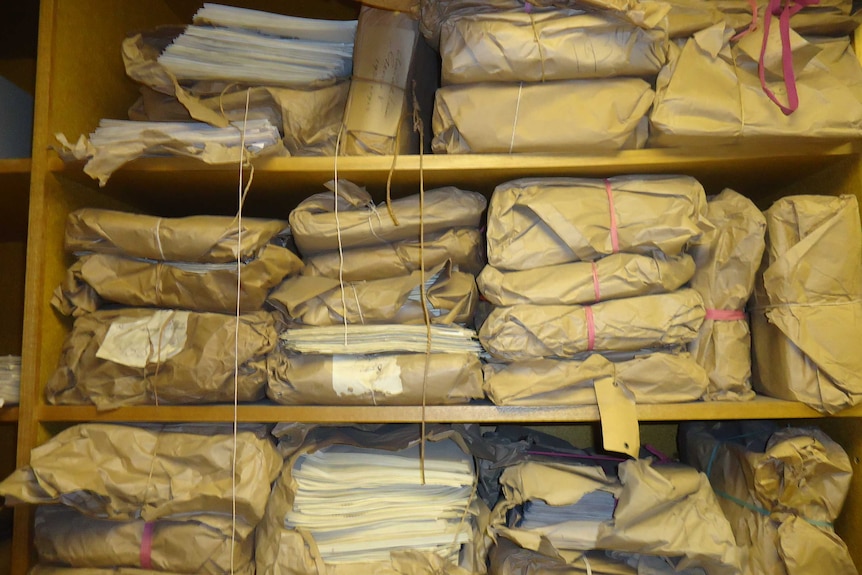The parcels containing original Tasmanian legislation in the storeroom before work started in the project