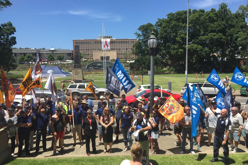 Union members protest outside Newcastle City Hall.