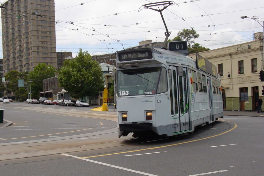 A route 1 tram travels along Elgin and Lygon streets in Melbourne.