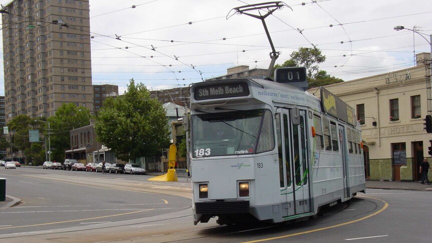 A route 1 tram travels along Elgin and Lygon streets in Melbourne.