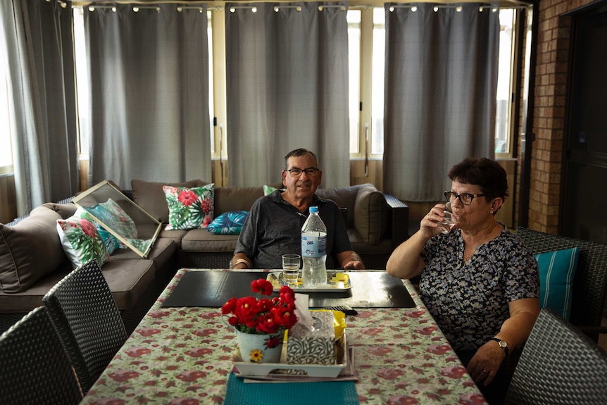 A man and a woman sitting at a table.