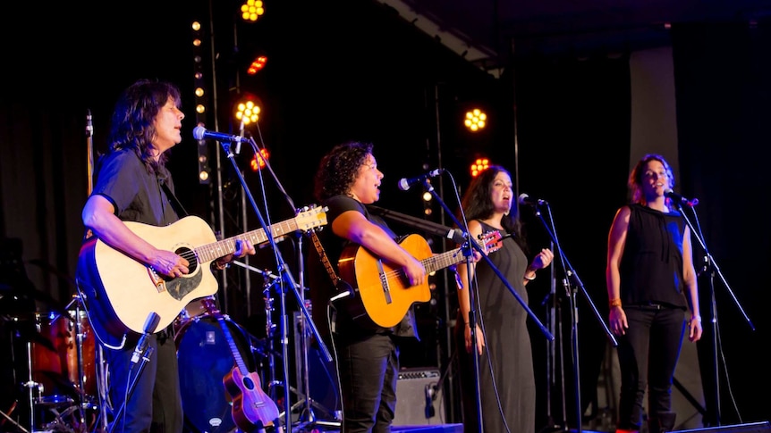 Performers on stage at Woodford Folk Festival