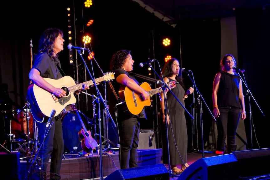 Performers on stage at Woodford Folk Festival