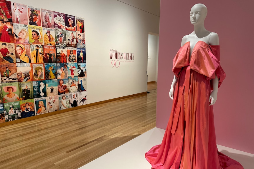 A woman's gown on a mannequin, set against a collage of Australian Women's Weekly covers.