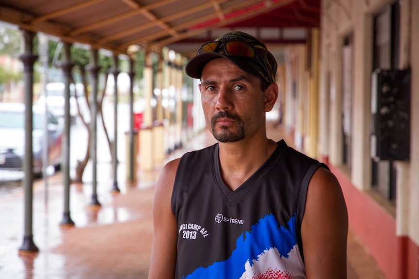 Brendon Anderson standing on the main street of Leonora.