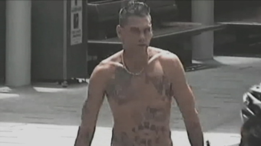 Mr Hillier, shirtless, during his 2013 siege. 