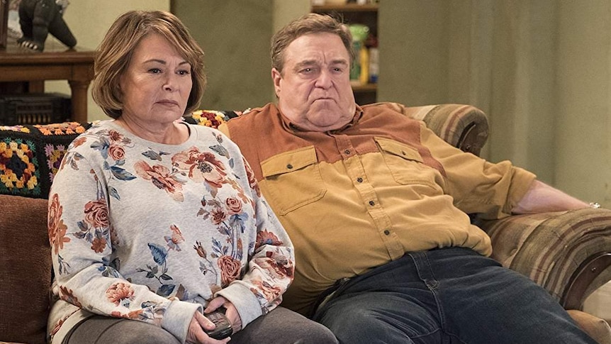 A scene from the Roseanne reboot shows Roseanne Barr and John Goodman