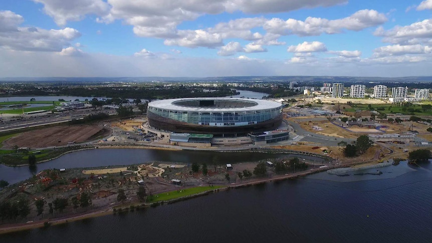 A wide shot of the new Perth Stadium taken from a drone flying above the Swan River.