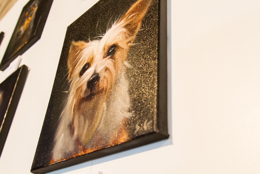 Painting of a small white dog with bright eyes.