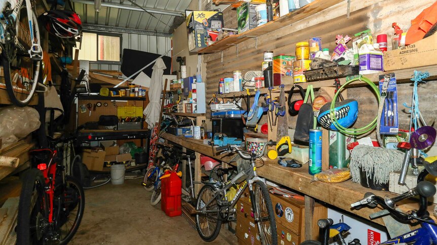 A garage full of clutter and various possessions.