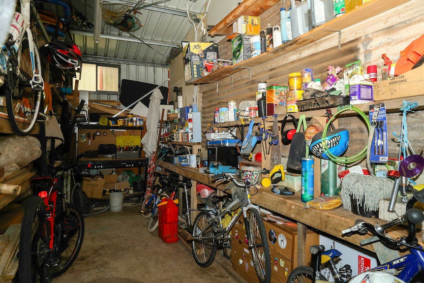 A garage full of clutter and various possessions.