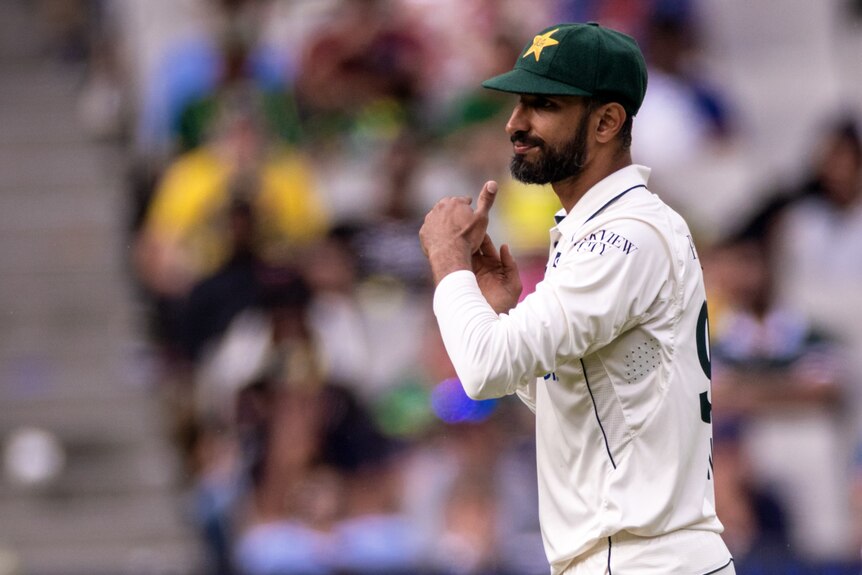 Shan Masood reviews for Pakistan during the Boxing Day Test by making a T with his hands.