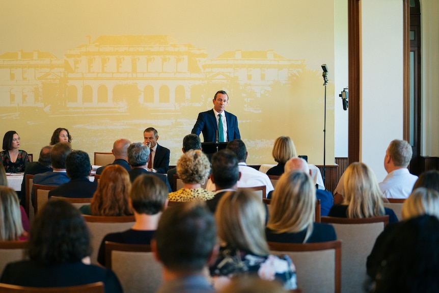 A wide shot of WA Premier Mark McGowan addressing Labor MPs sitting in front of him.