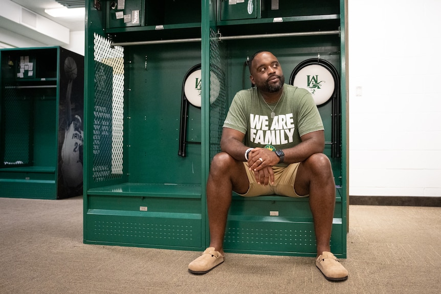 Willie sits in a locker.