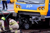 A car wedged under a train at Surrey Hills